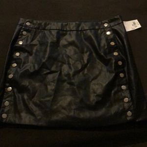 Black pleather skirt with silver accent snaps!